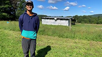 A person standing on a green field