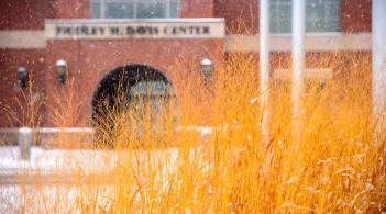 The third-floor exterior of the Davis Center shimmering on the first snowy day of the year.