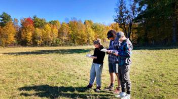 Students taken notes in field