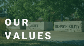 Display of the stones found on campus with words openness, justice, and responsibility engraved on them. With the text "Our Values" over it.