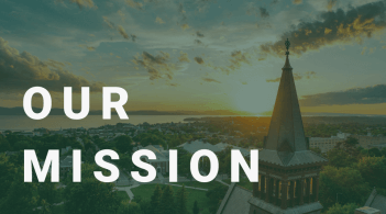 Aerial shot of University of Vermont Campus with sun setting in the background. With the text "Our Mission" over it
