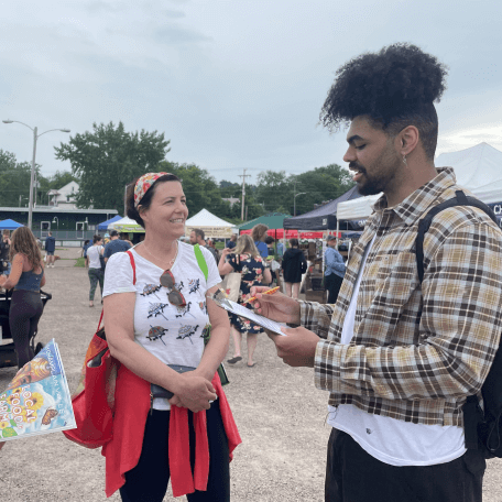 Students doing a survey at a farmer's market