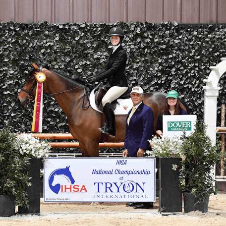 Girl on a horse winning the National Equestrian Championships
