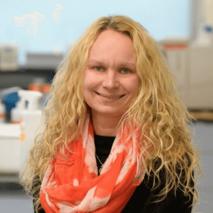 Faculty headshot of Dr. Kraft in a lab