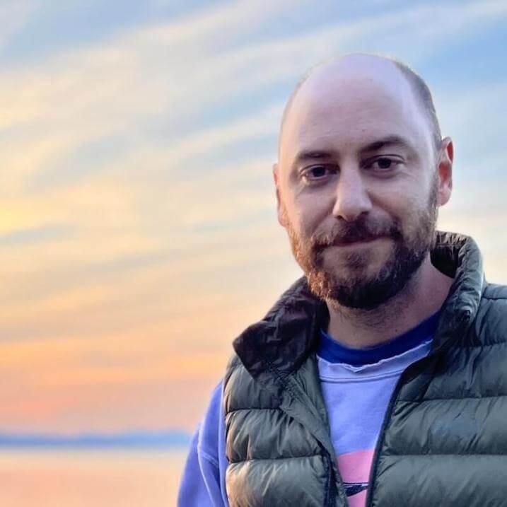 Matthias with a sunset behind him