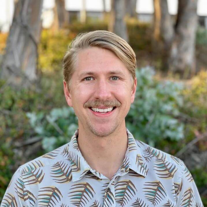 Steve in front of a grove of trees