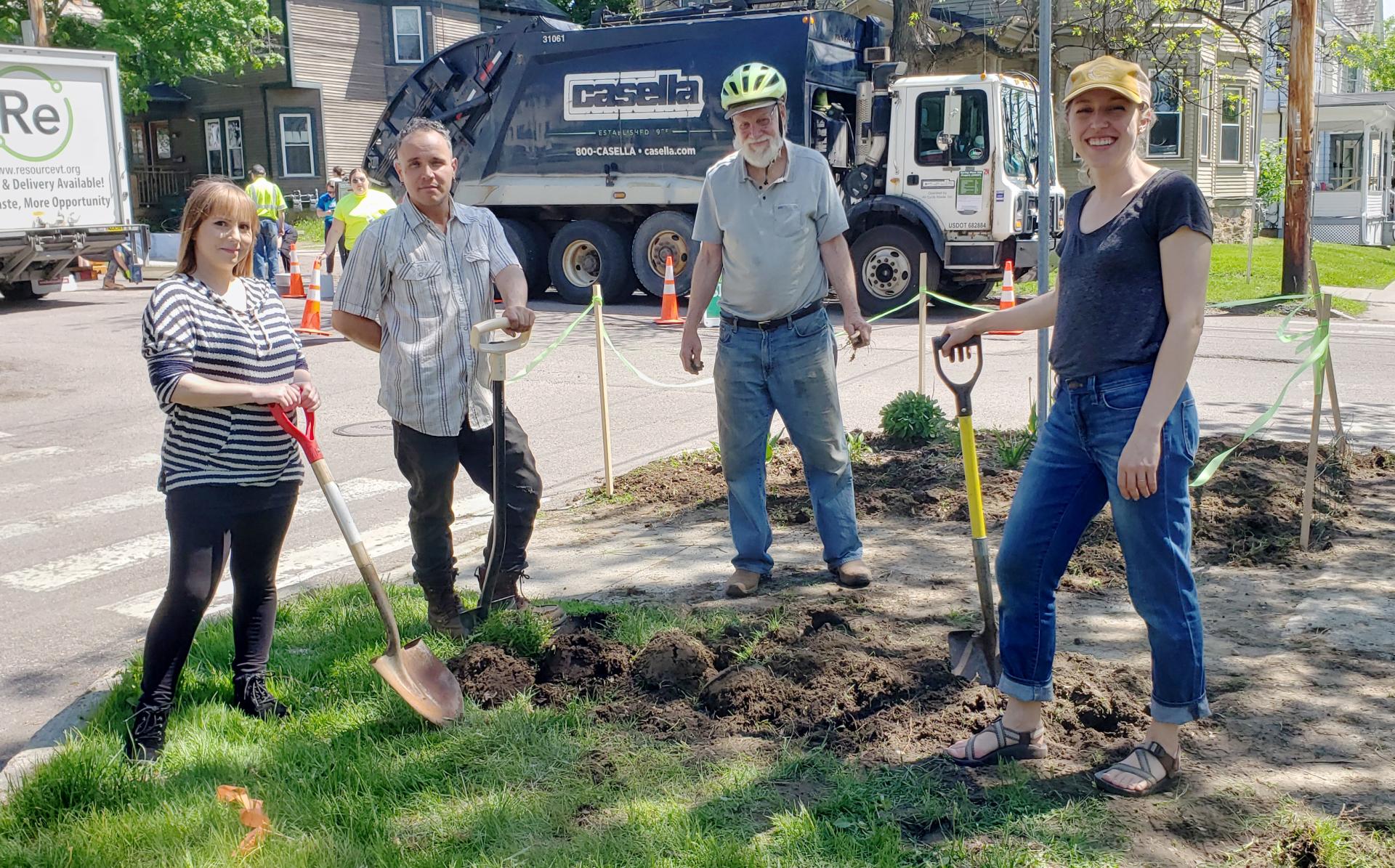A group of people standing with shovels preparing a greenbelt garden spot.
