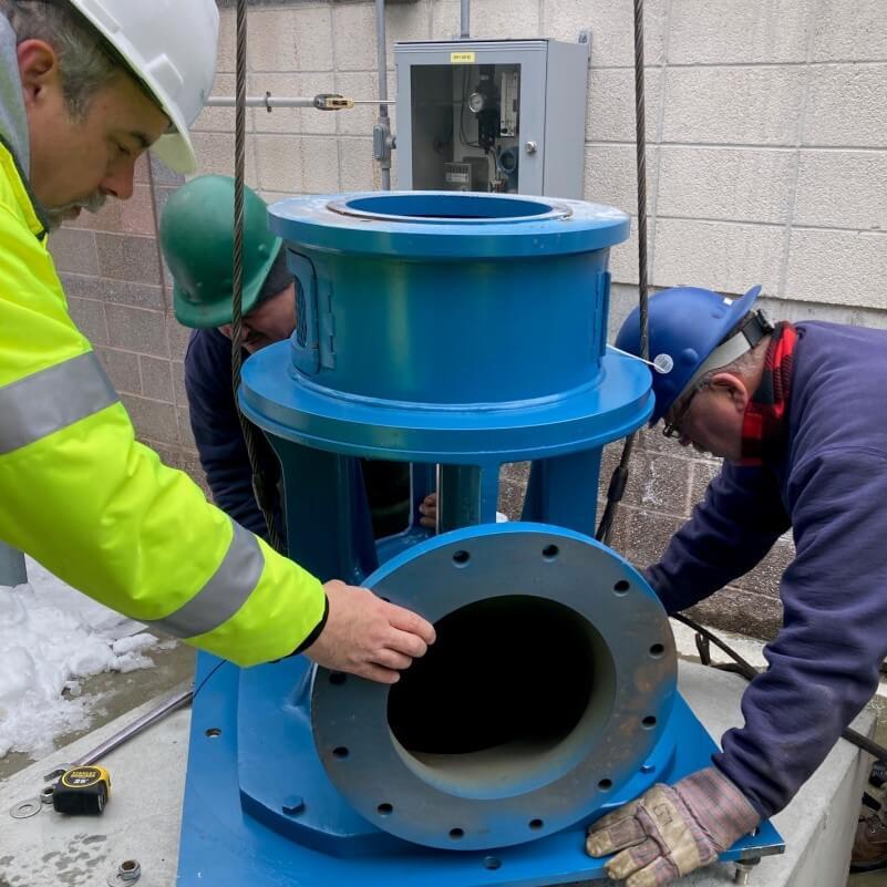 engineer installing a large pump