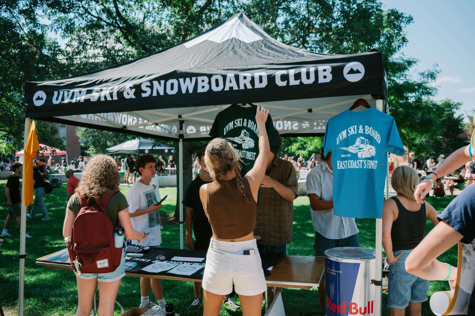 UVM Ski and Snowboard Club setting up their table during an activity fair