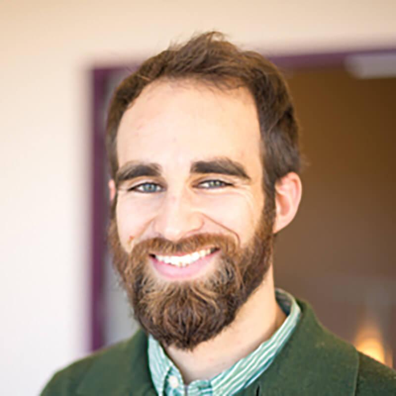 profile image of a person with a green shirt 