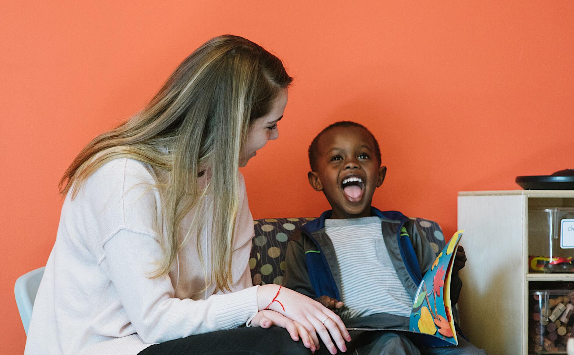 Service-learning student works with a new American child at the King Street Center in Burlington.