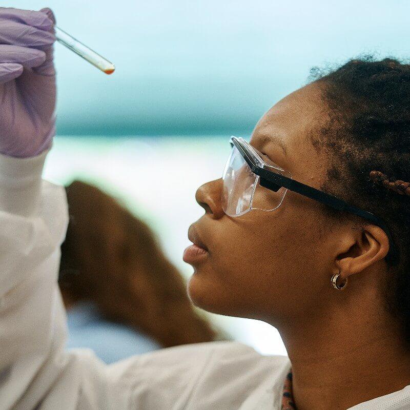 Student holding test tube