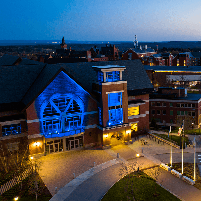 Davis Center at Night lite up in blue ligths