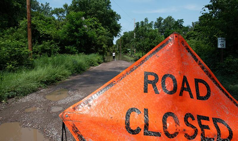Road closure sign placed due to flooding