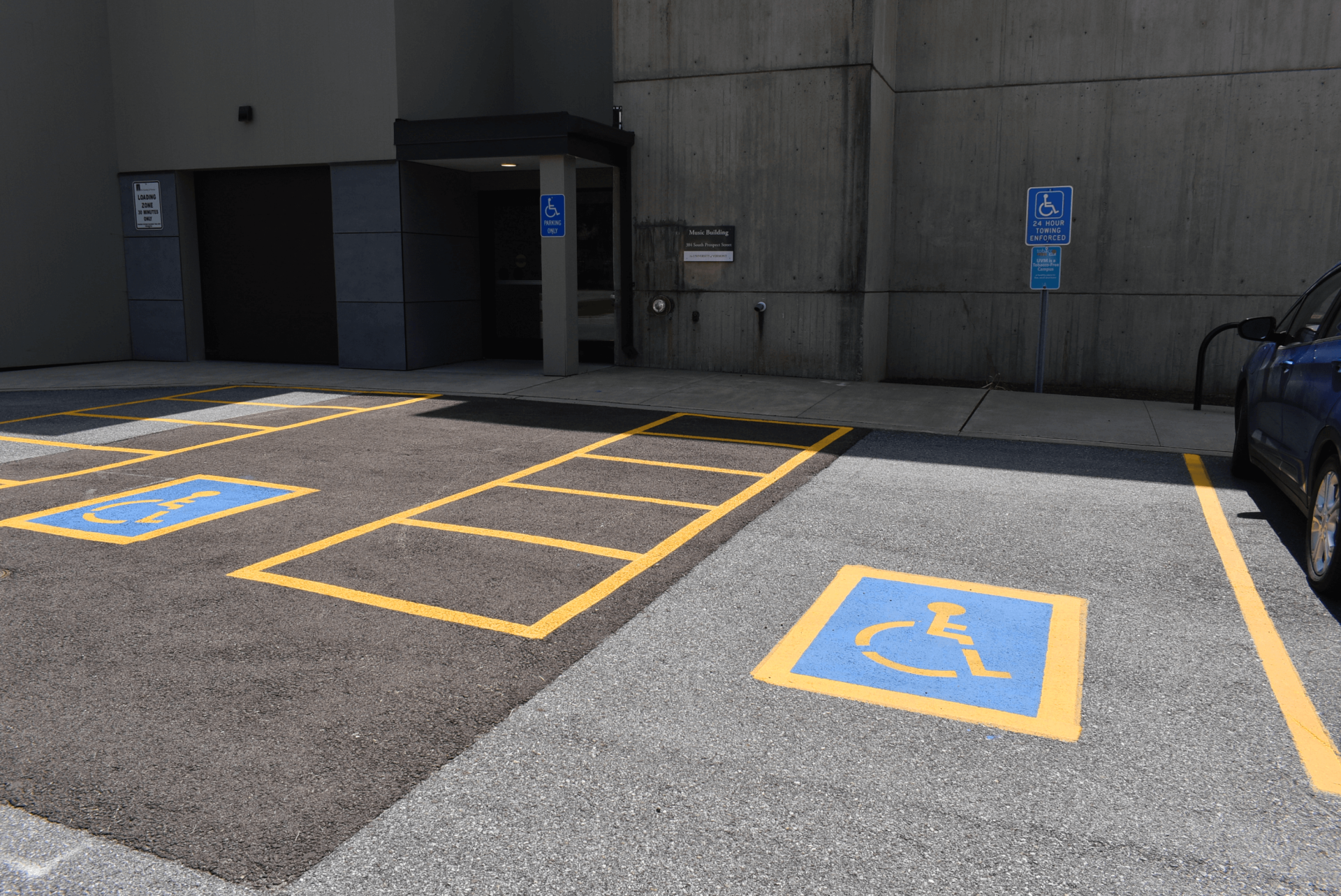 Two empty accessible spaces at the Music Building on the UVM campus