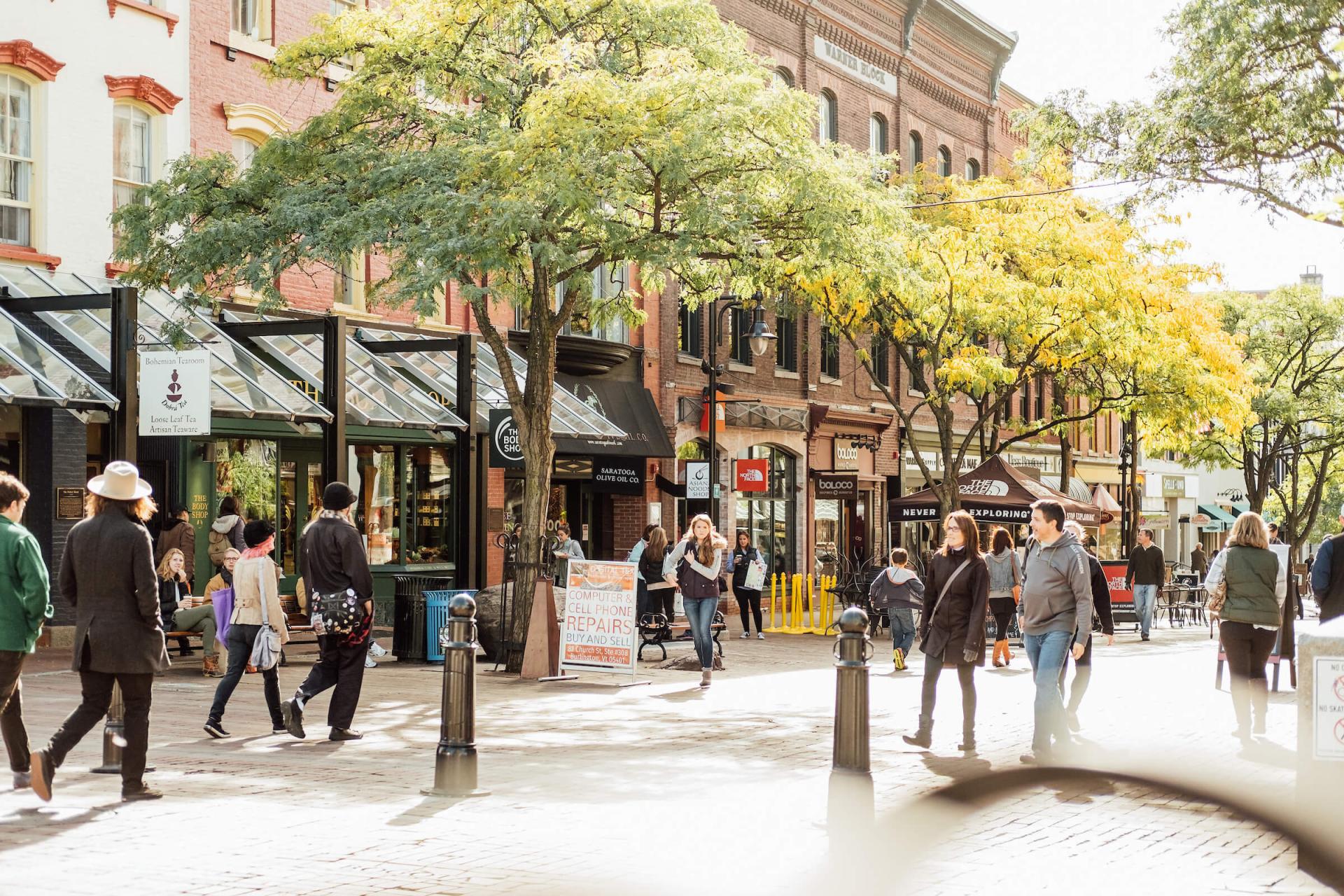 People walking along a pedestrian street in a city