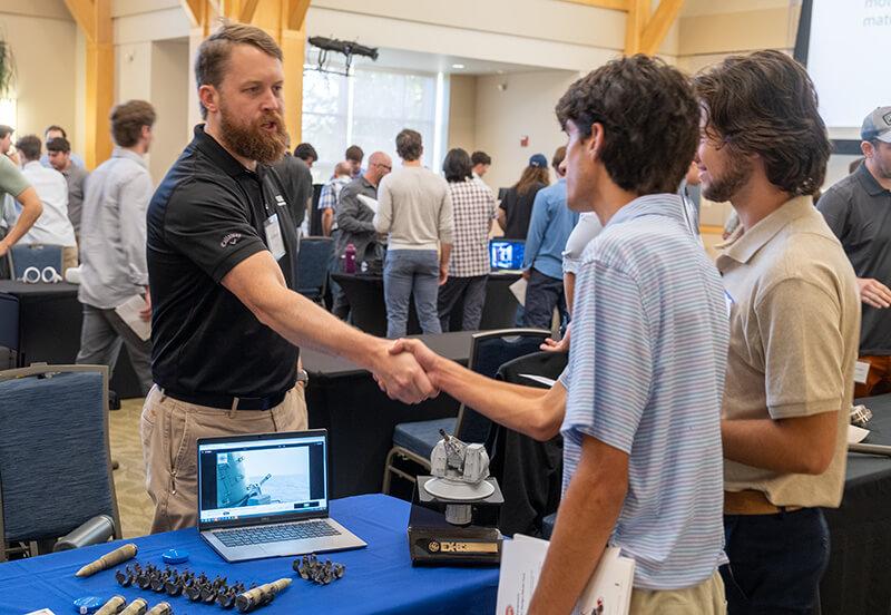 A technology company representative pitches their idea for a potential senior capstone project