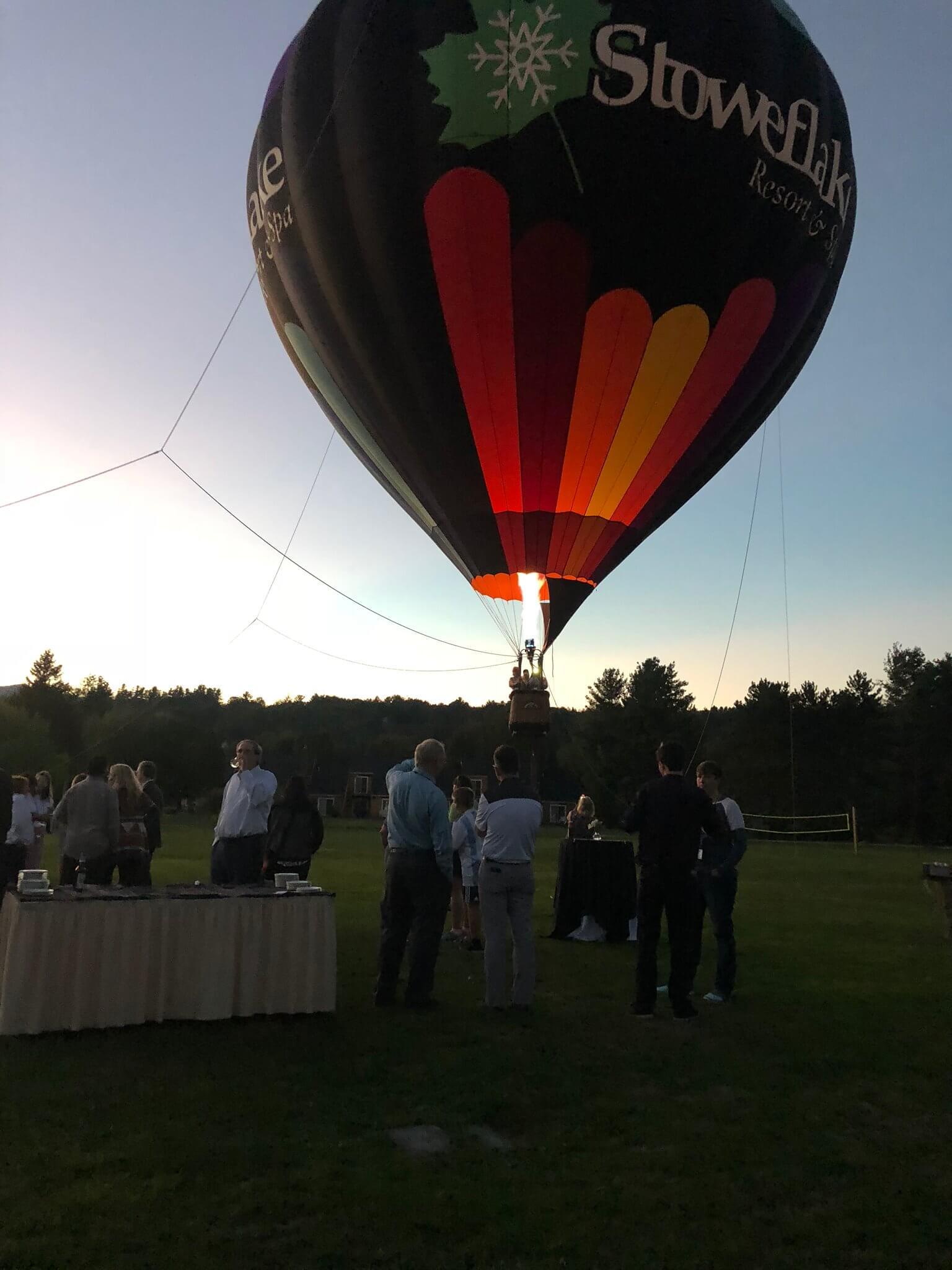 a hot air balloon being raised into the sky