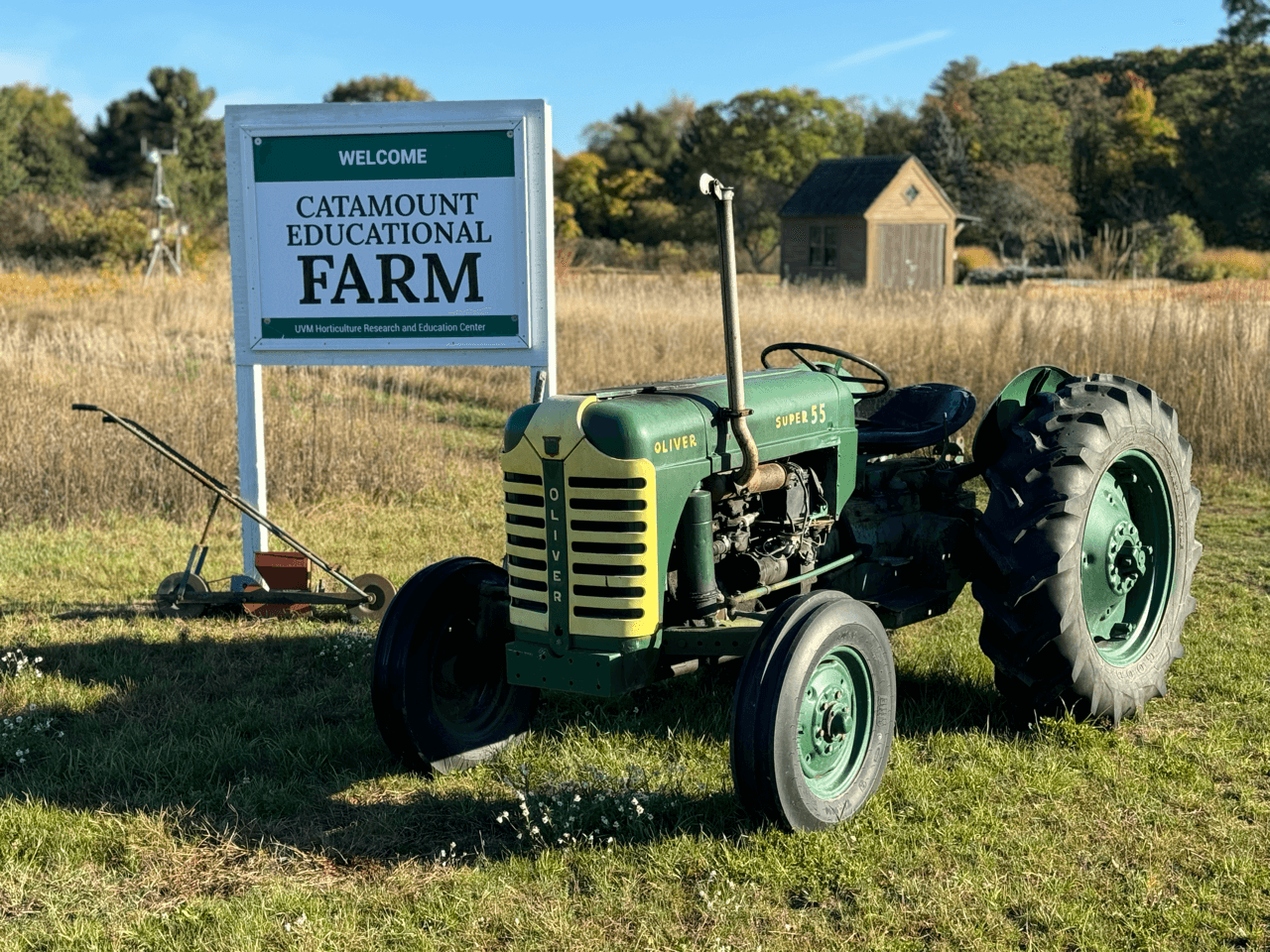 antique tractor and catamount farm sign
