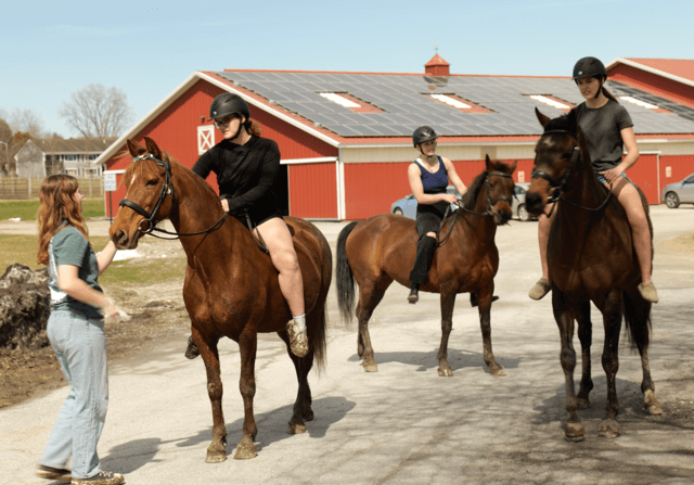 Three students on horseback at the Miller Farm