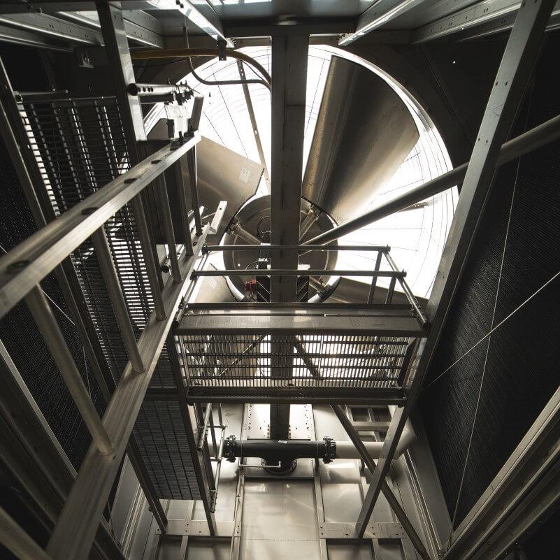 an industrial-sized fan located inside cooling tower used to make chilled water