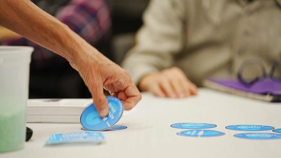 blue circle decals laid out on table to demonstrate 3 inch distance.