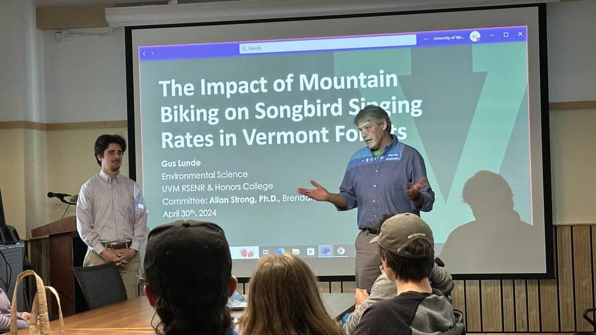 Allan Strong speaking to the crowd at Gus Lunde's thesis defense