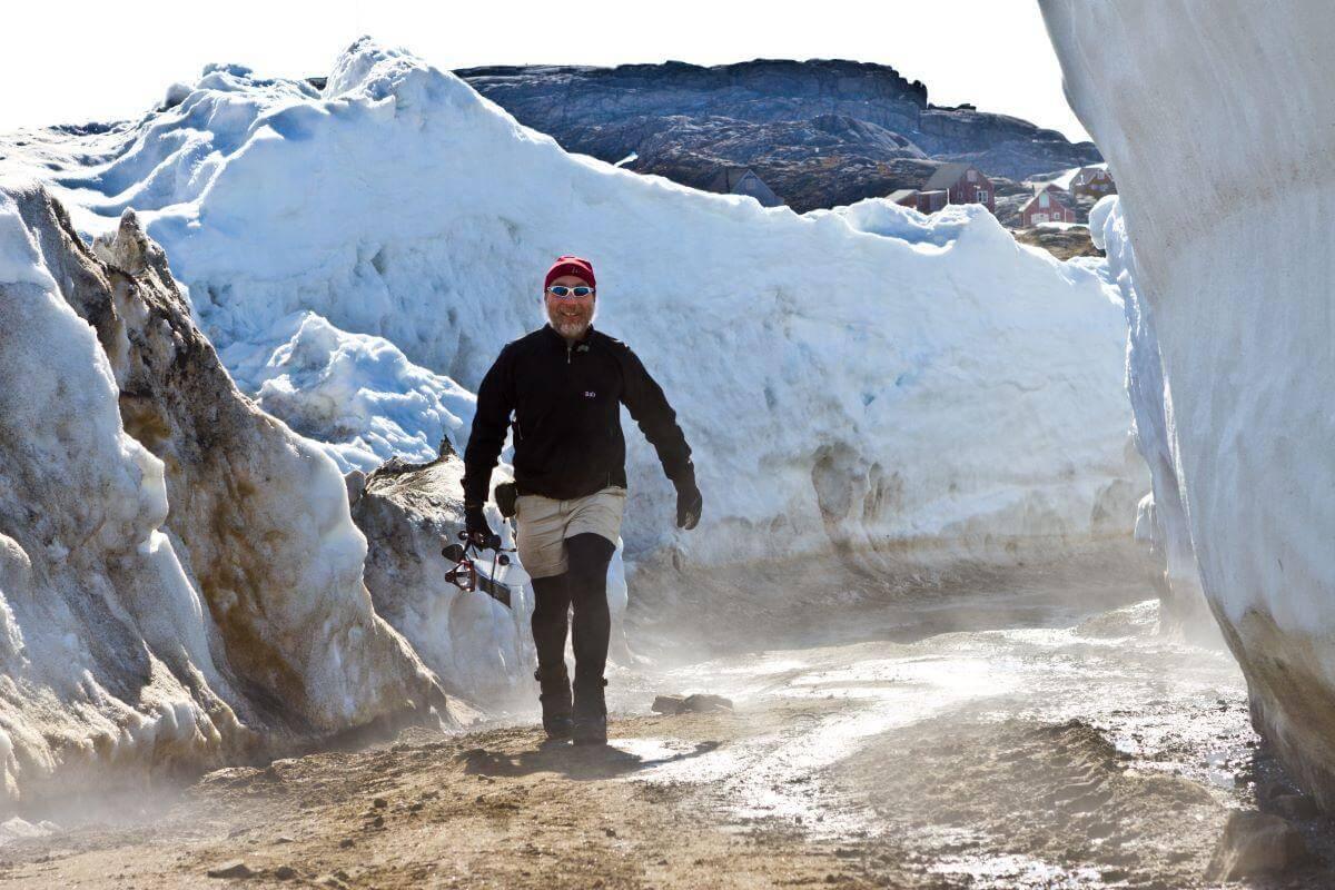 Paul Bierman walking amongst ice walls in Greenland