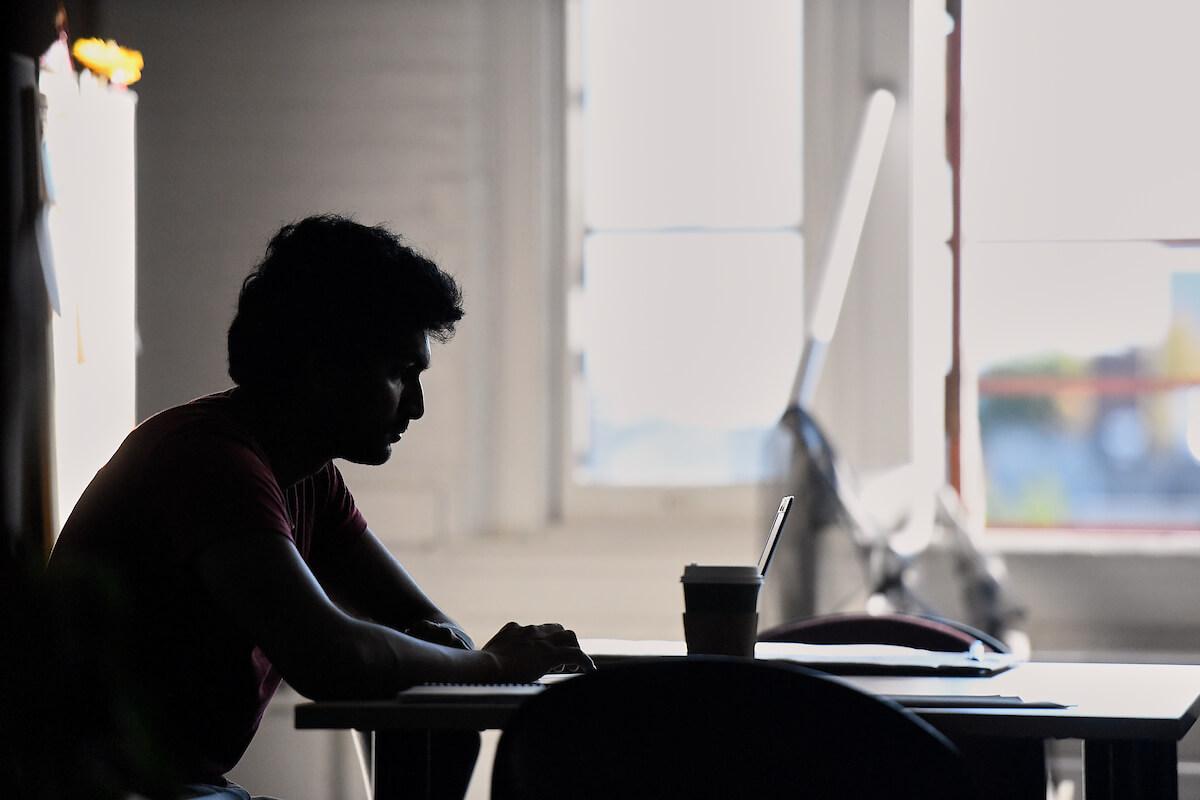 Person sitting at a computer 