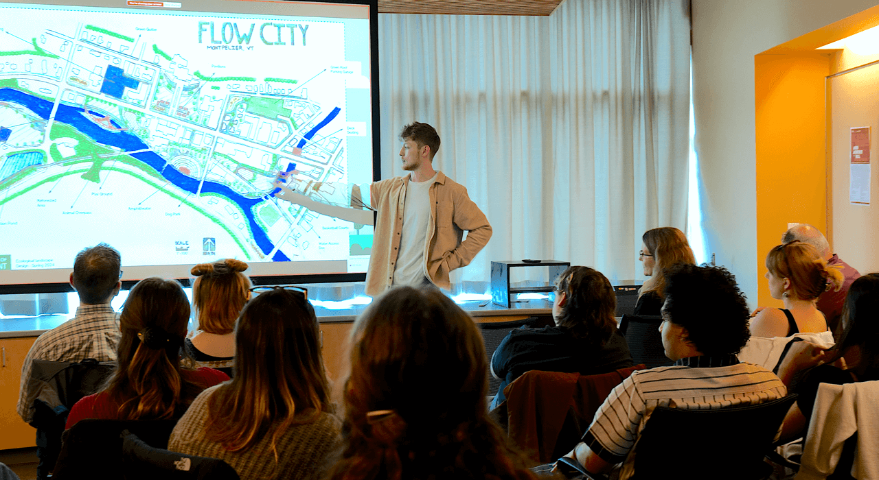 Student giving a presentation of a redesign of Montpelier Downtown