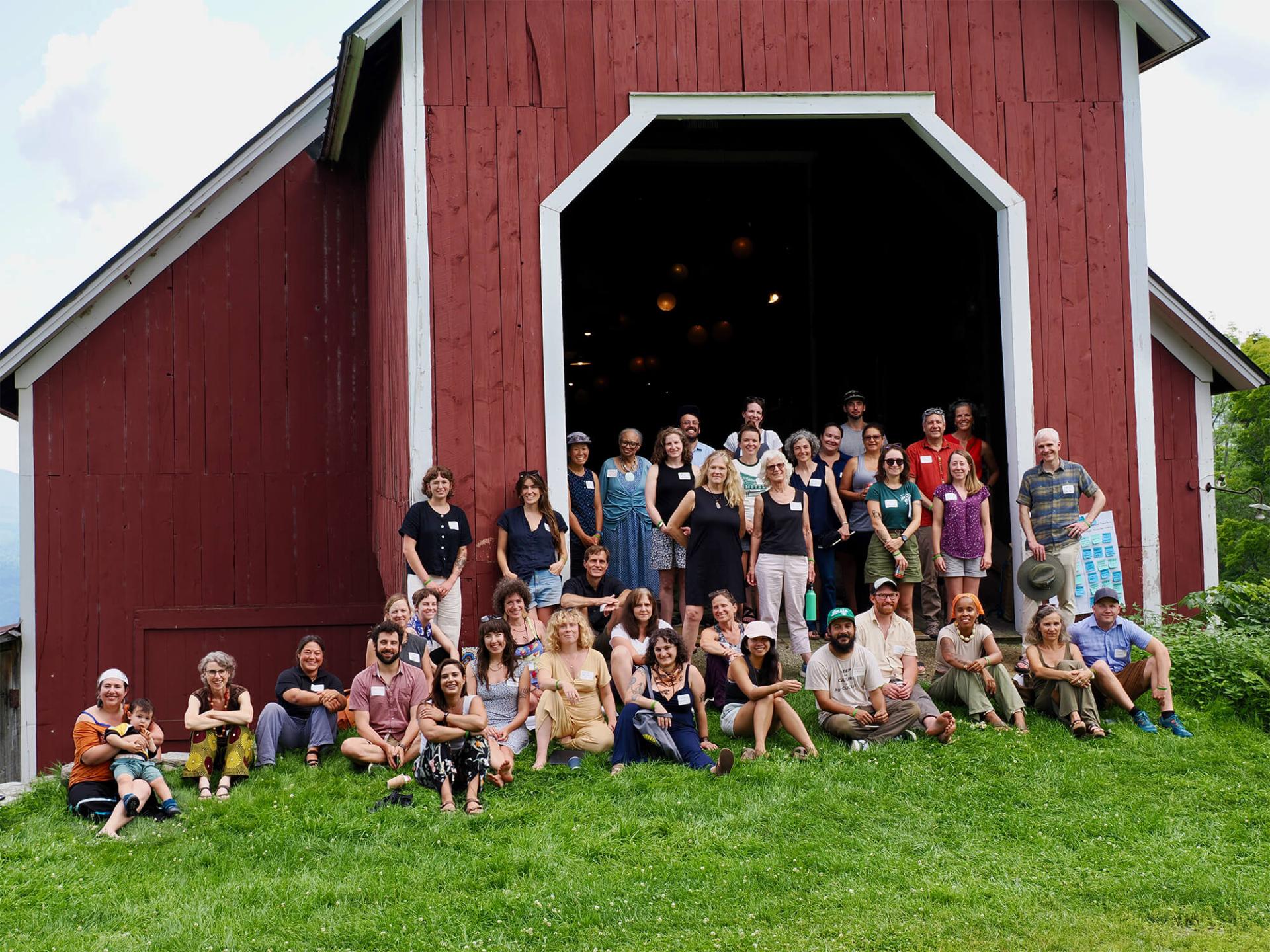 Workshop participants gathered in front of the historic barn at Knoll Farm. The Knoll Farm Barn was salvaged, taken down, moved piece by piece by oxen and resurrected on its current location in 1923 by the McLaughlin family.