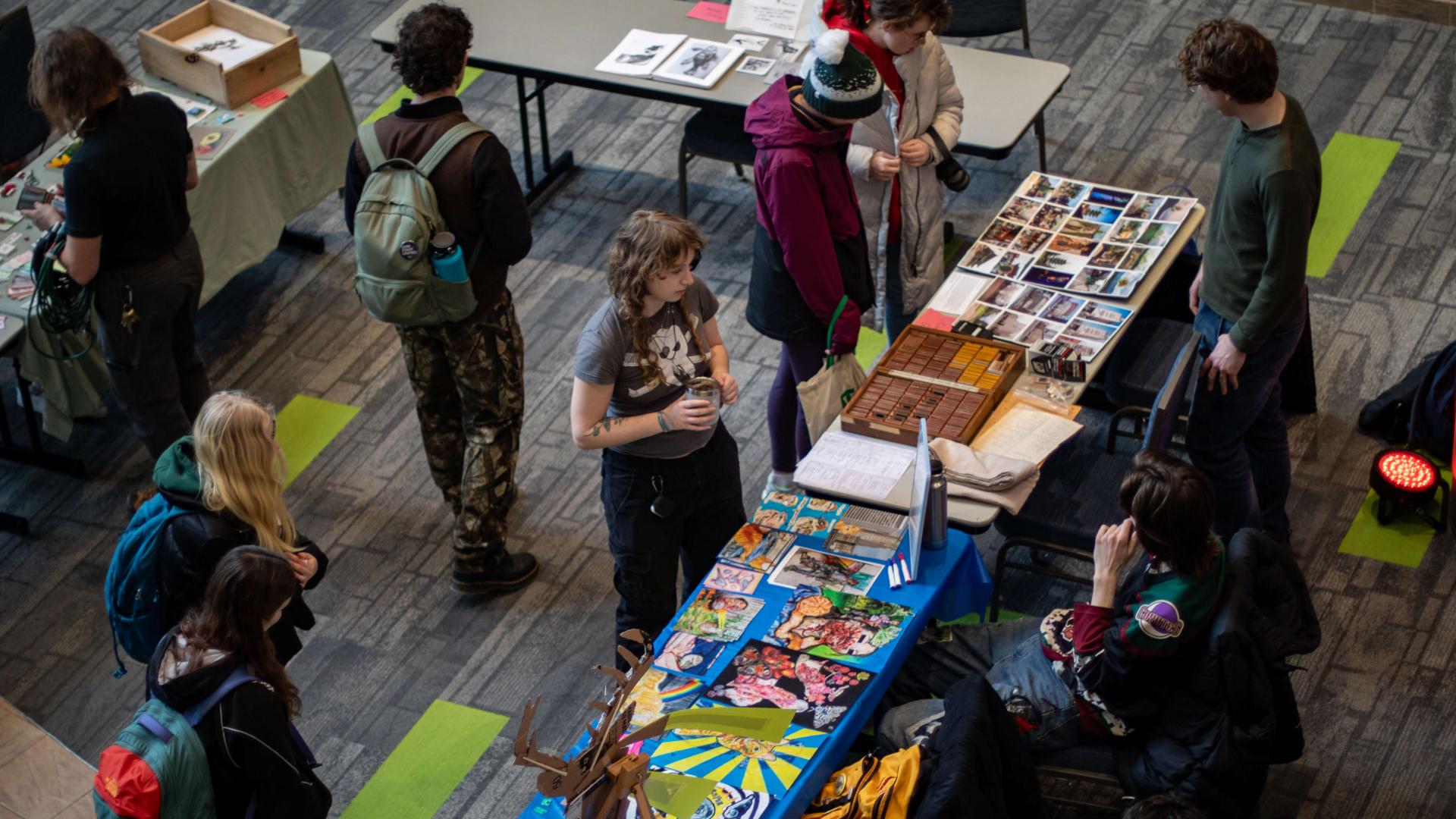At the center of the event were over twenty student artists tabling with their artwork.