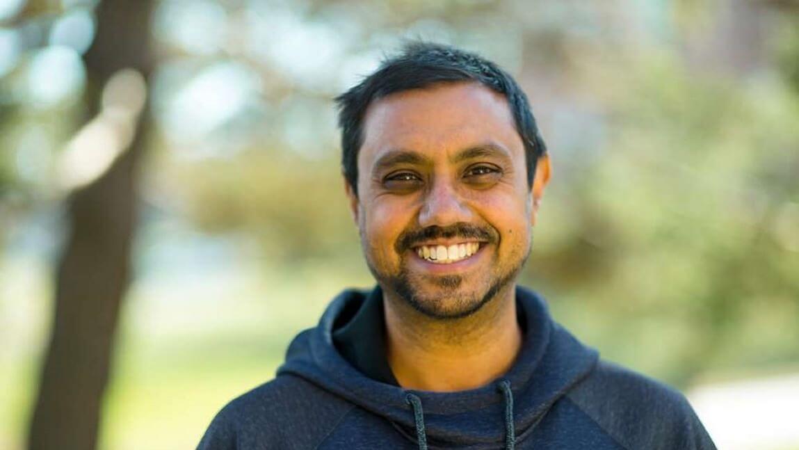 Pablo Bose standing in front of some trees. 